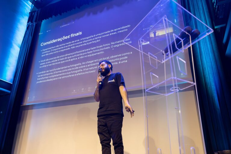 A speaker engages the audience during a conference presentation.